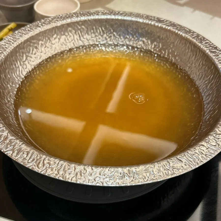 Clear mushroom broth starting to boil