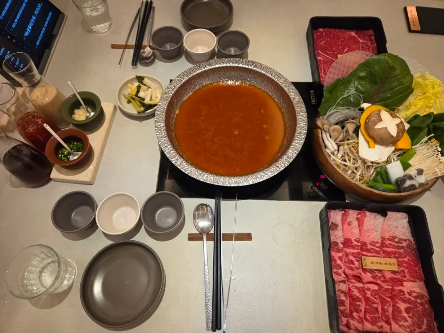 Spicy mushroom broth bubbling in the hot pot