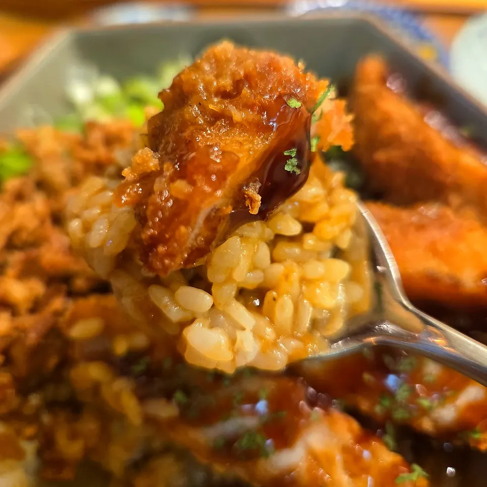 Scooping up rich curry together with rice