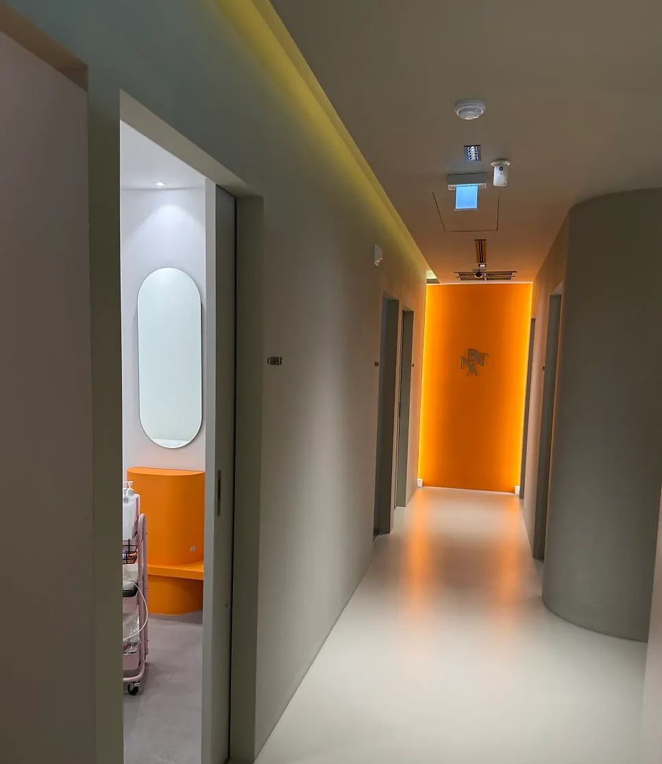 Inner hallway divided into skin care, lash, and waxing rooms