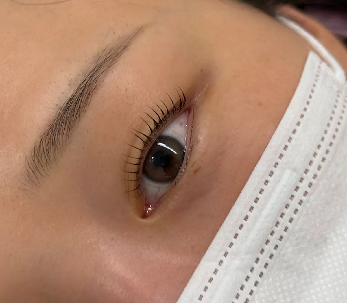 Finished lash lift with lifted curl on hooded eyes