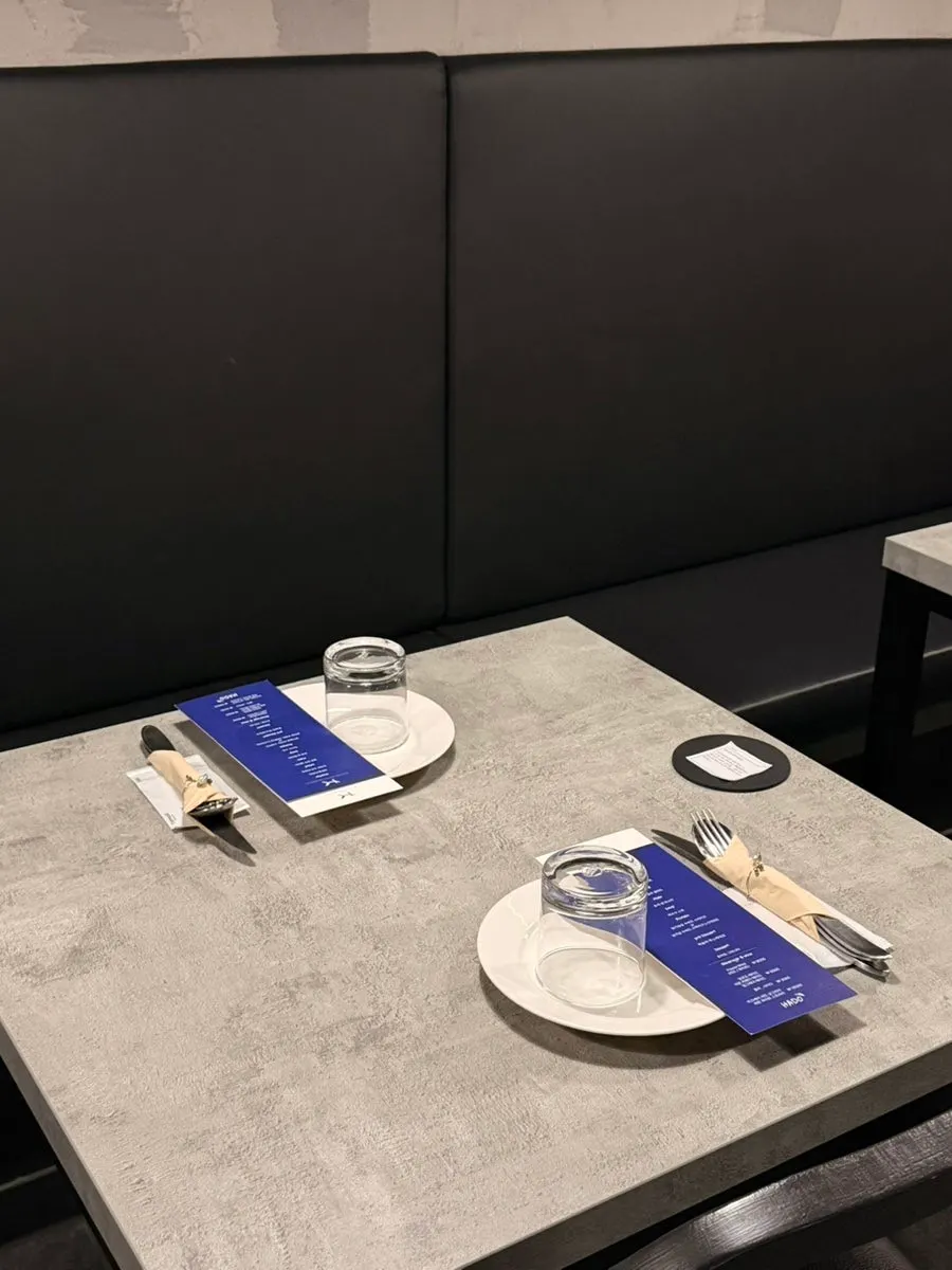 Hado's basic table setting with a course guide card