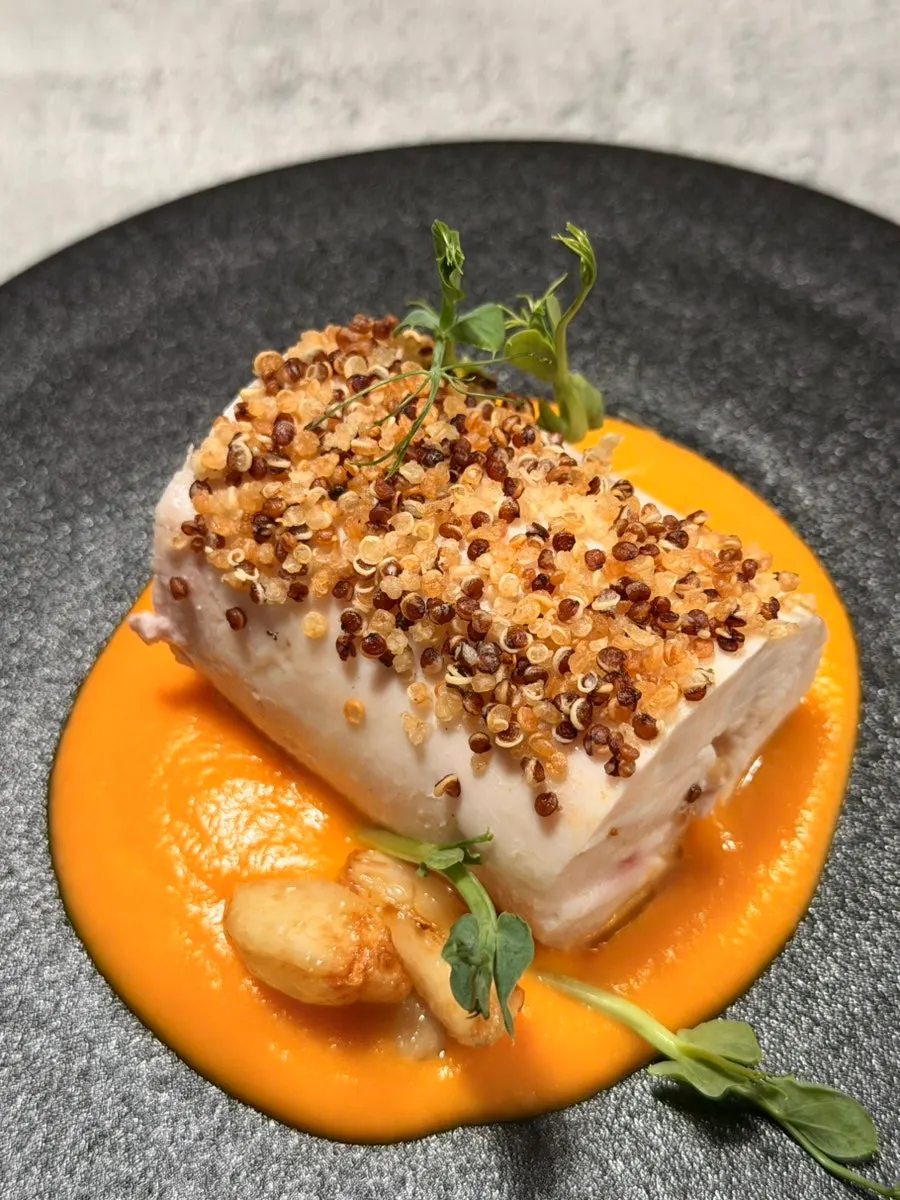 Chicken breast over orange carrot sauce