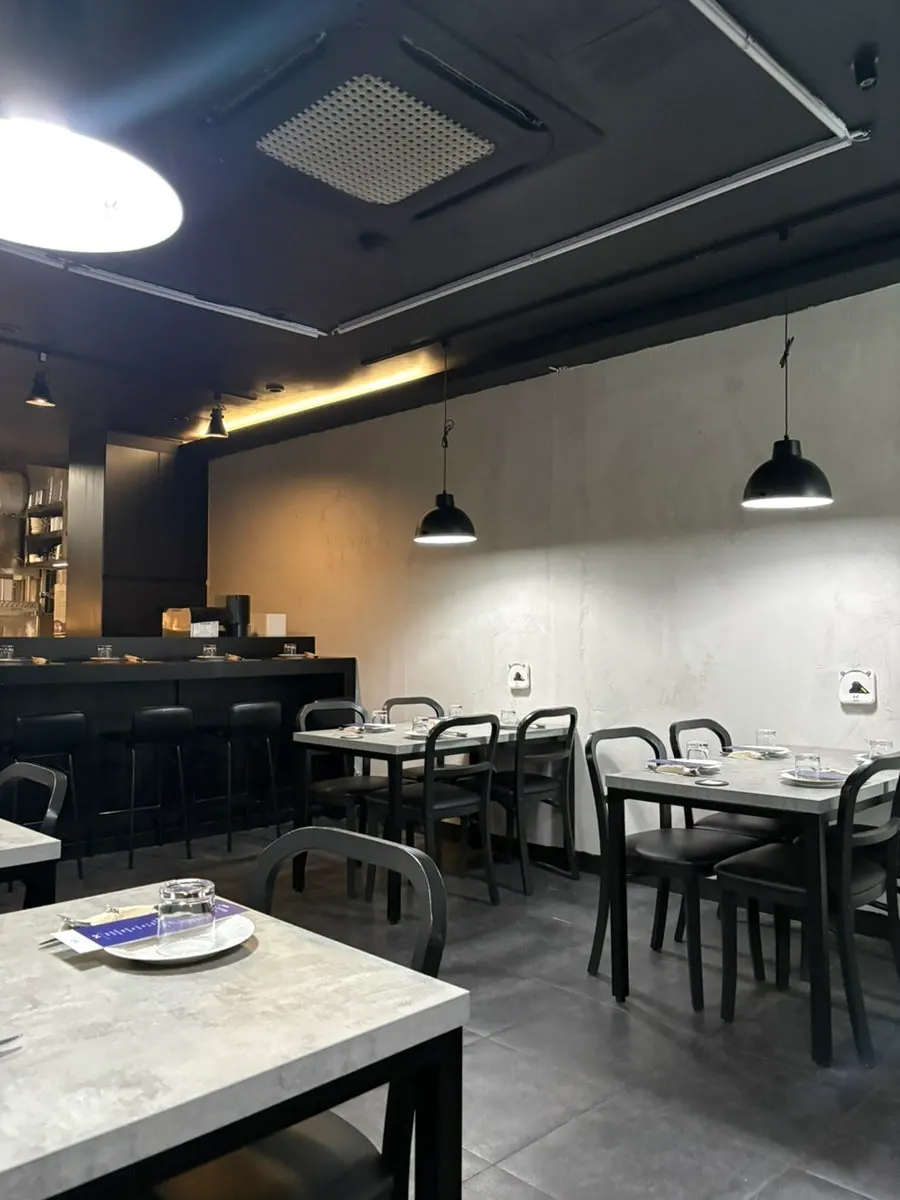 A dimly lit table seat at Hado