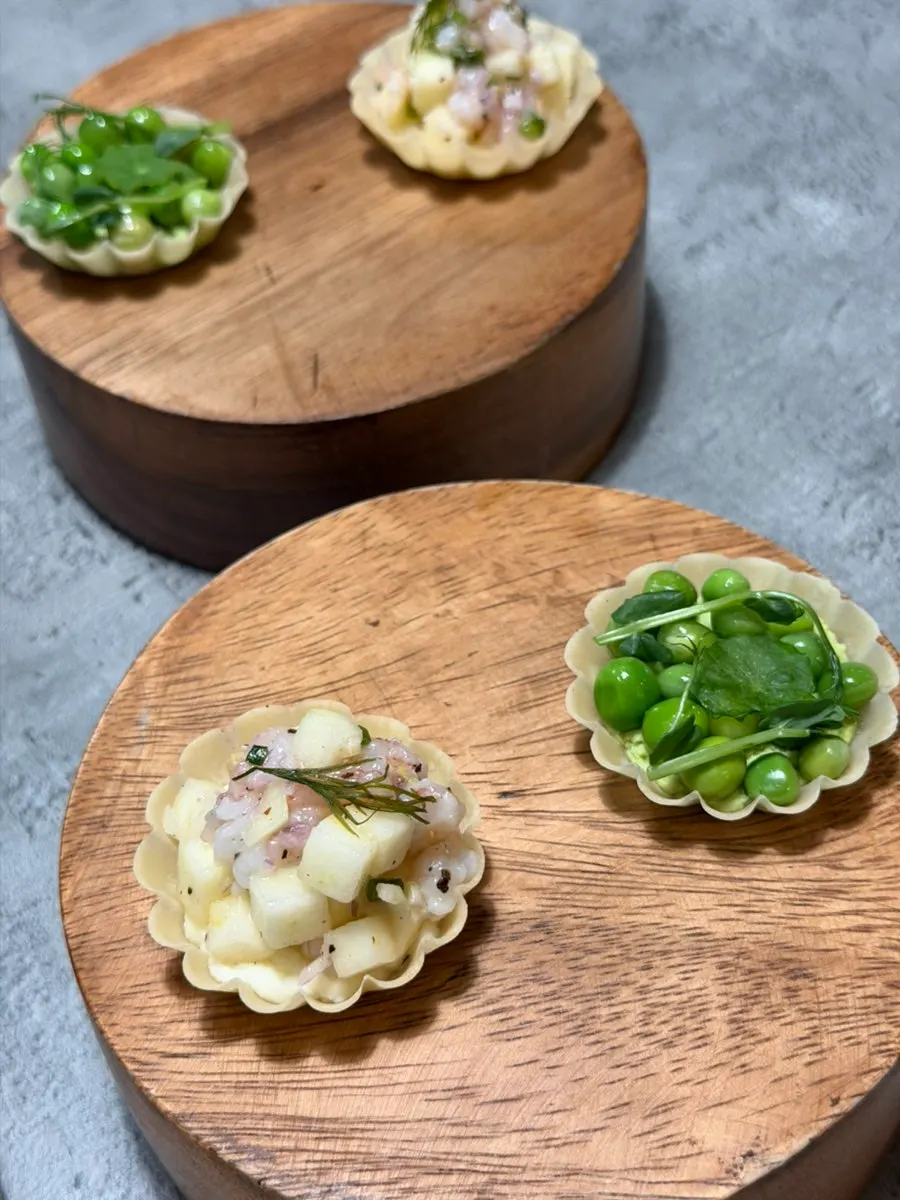 Plating of green pea tart and sweet shrimp apple tart