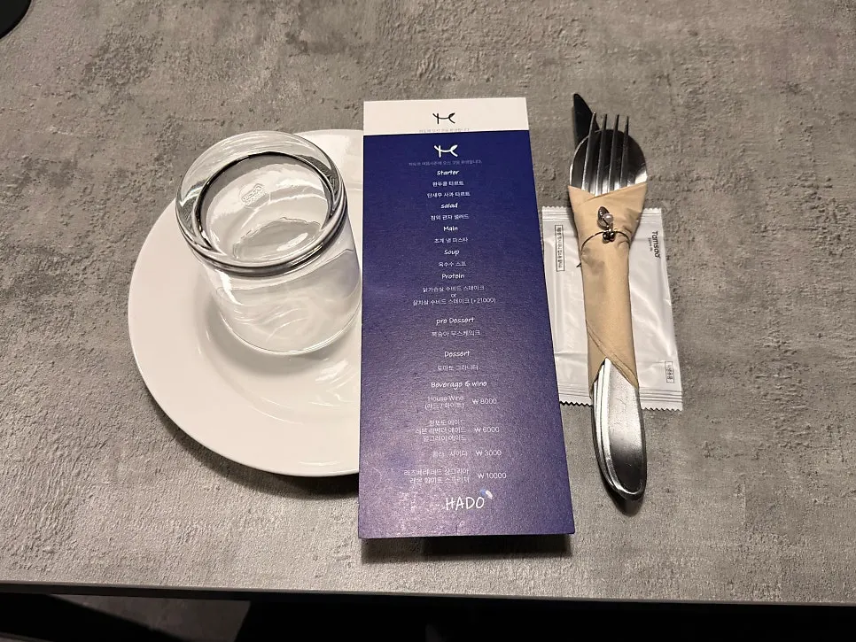 Table set with cutlery and course description