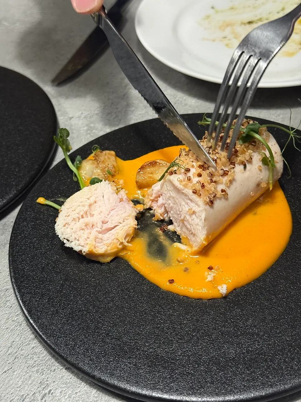 Close-up of chicken breast steak with crispy topping