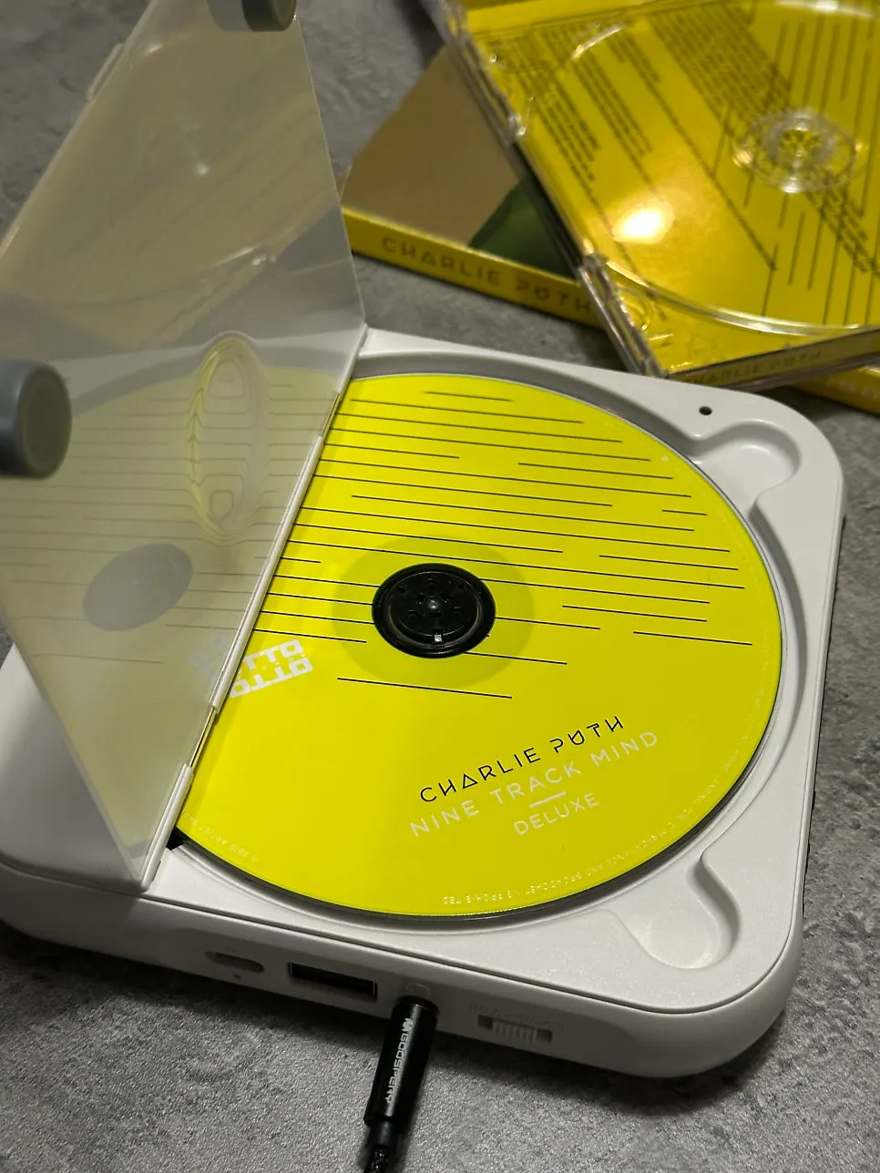 CDs and wired earphones placed near the entrance