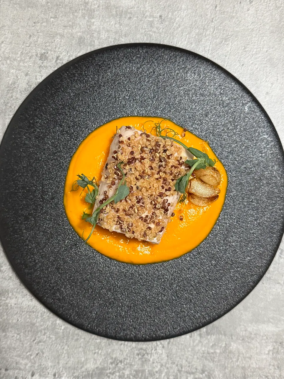 Chicken breast sous vide topped with fried quinoa
