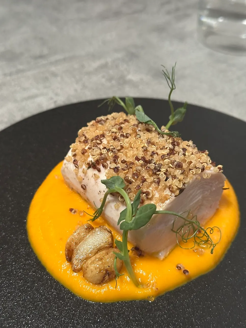 Cross-section of chicken breast sous vide with carrot purée