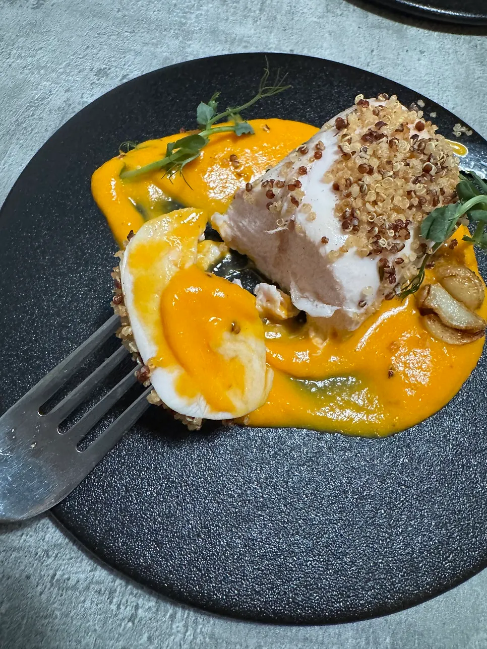 Chicken breast steak plated with roasted garlic