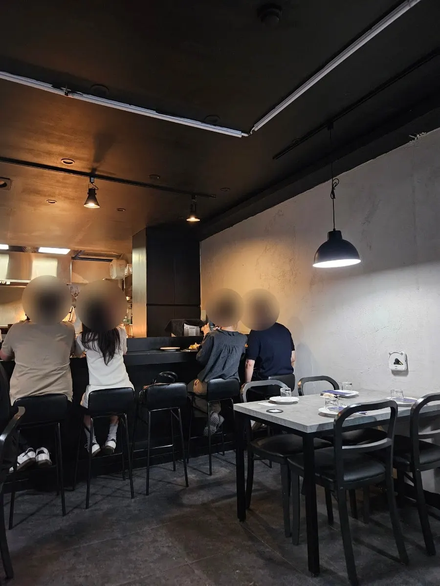 Interior of Hado with black-toned decor