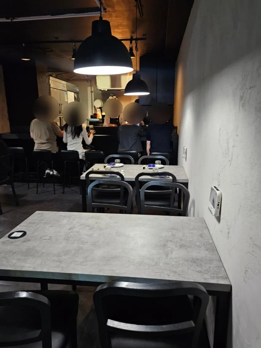 Bar seats at Hado facing the open kitchen