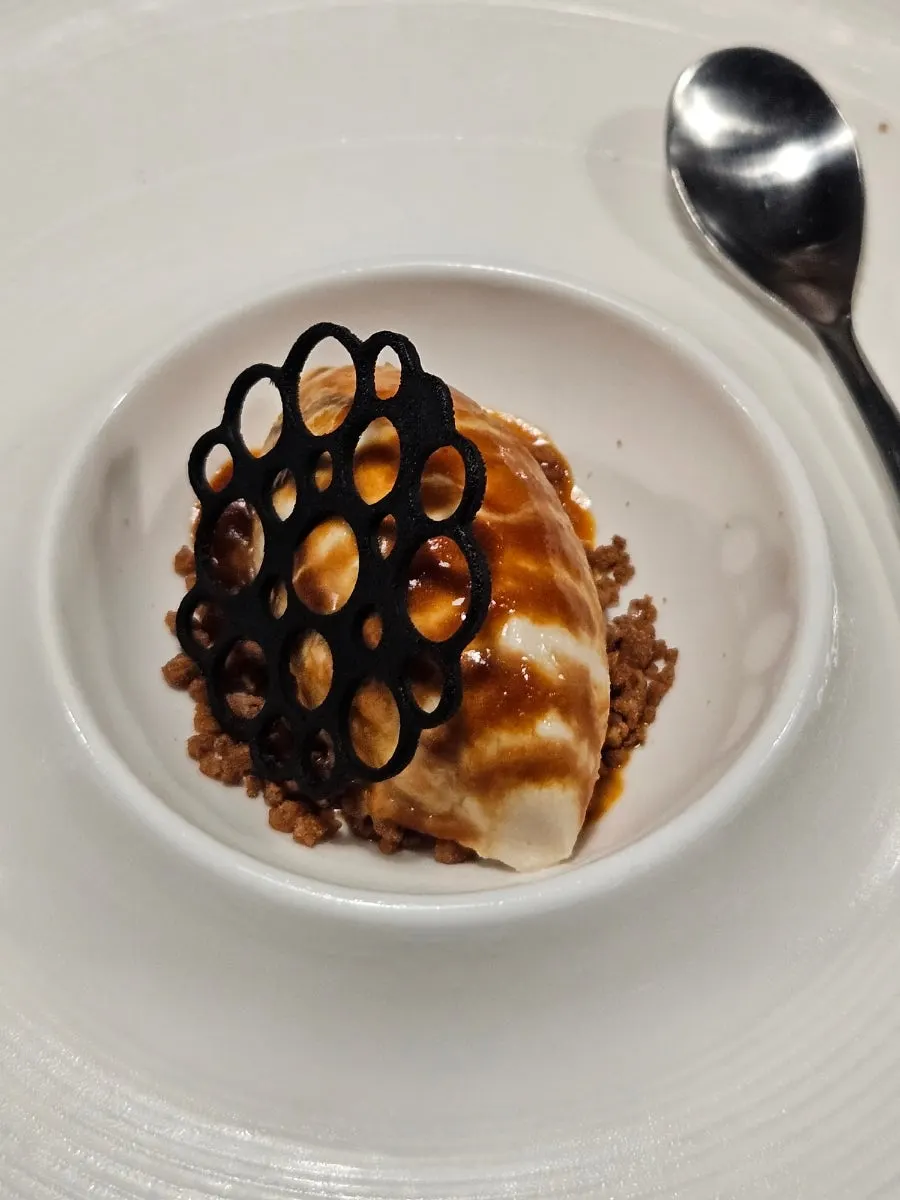 Course dessert with chocolate cookie and crumble