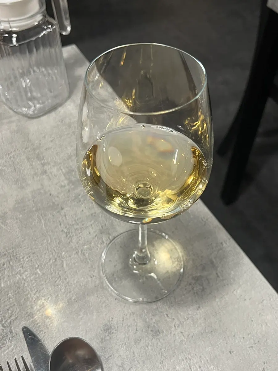 A glass of Hado's house white wine