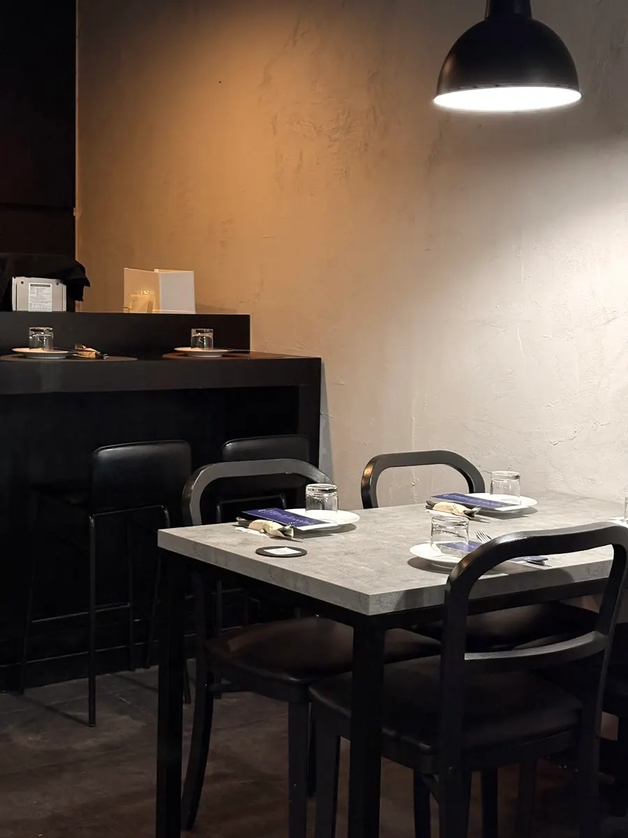 Bar seats in front of Hado's open kitchen