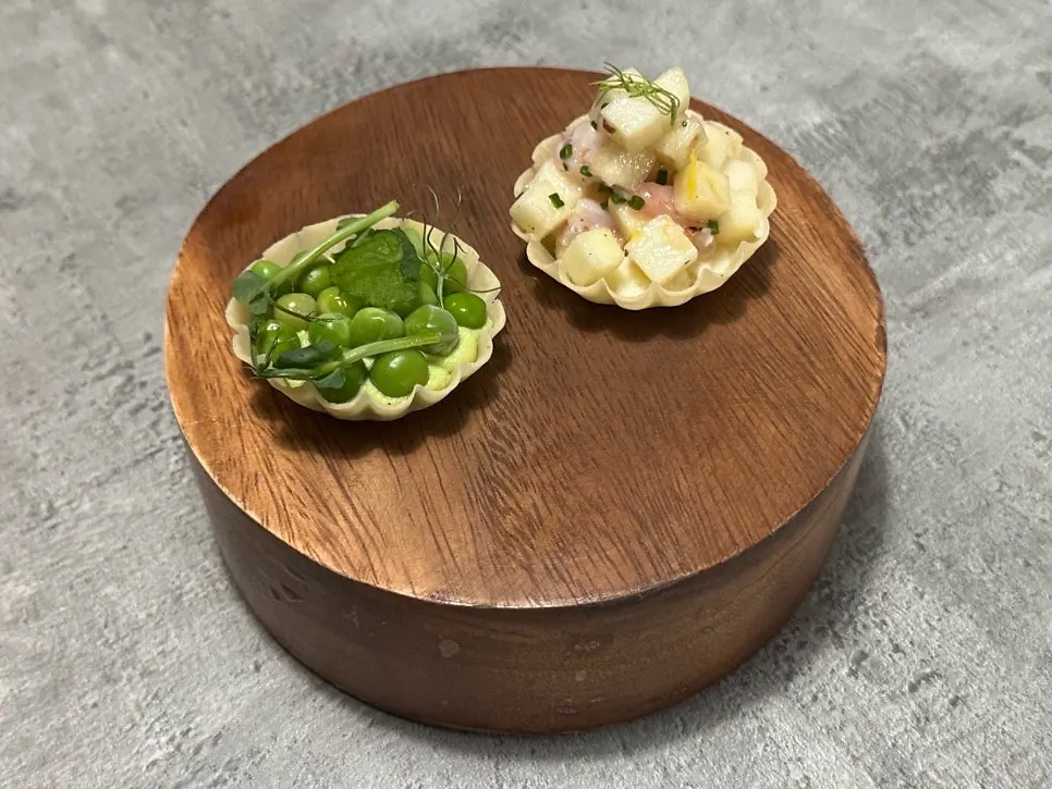 Plating of two appetizer tarts