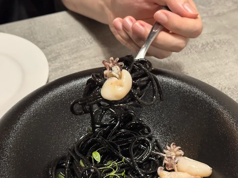 Bisque pasta and squid ink pasta side by side