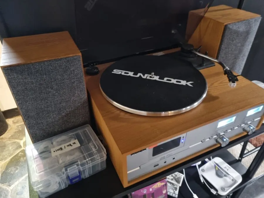 CDs, blankets, and chargers set up inside Hado