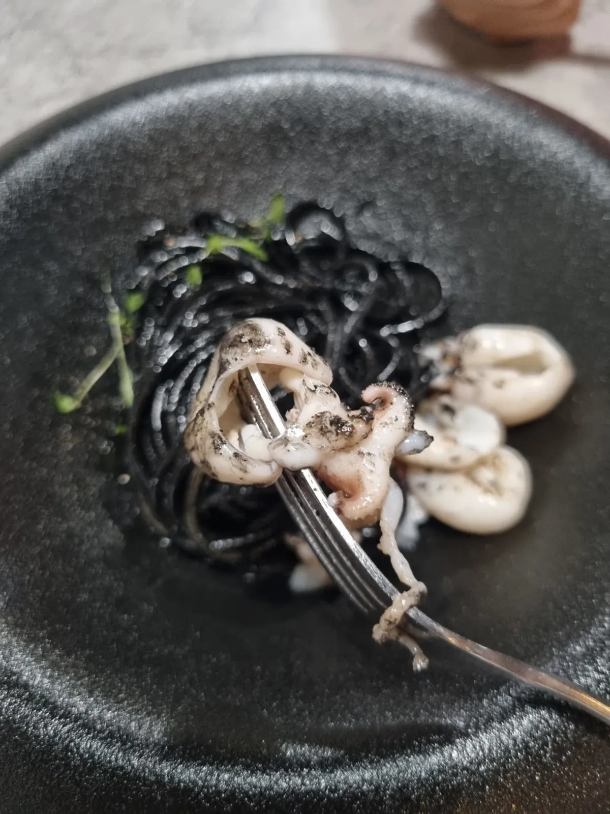 Squid ink pasta with a rich, dark sauce