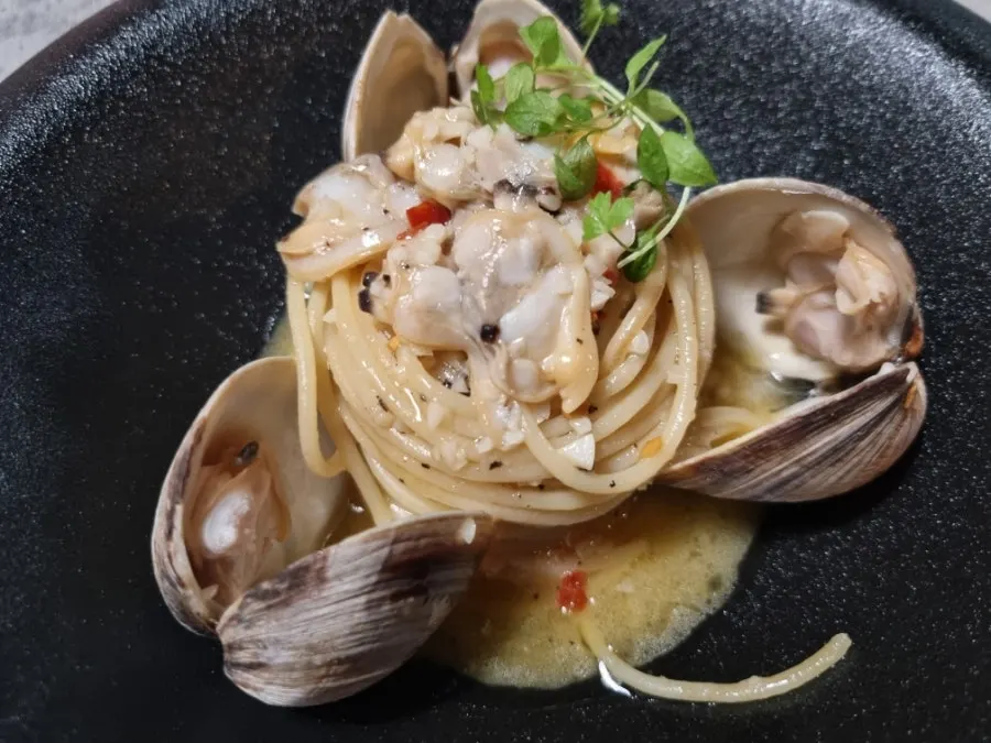 Hado's vongole pasta topped with clam meat