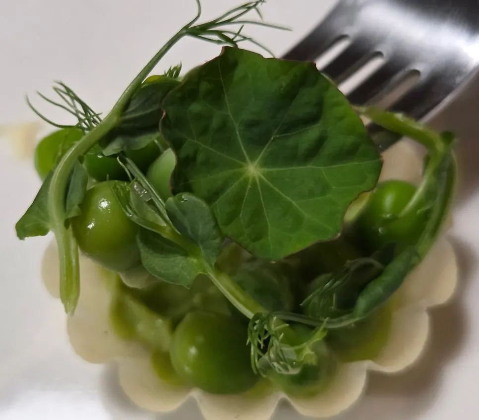 Pea tart topped with peas and vegetables