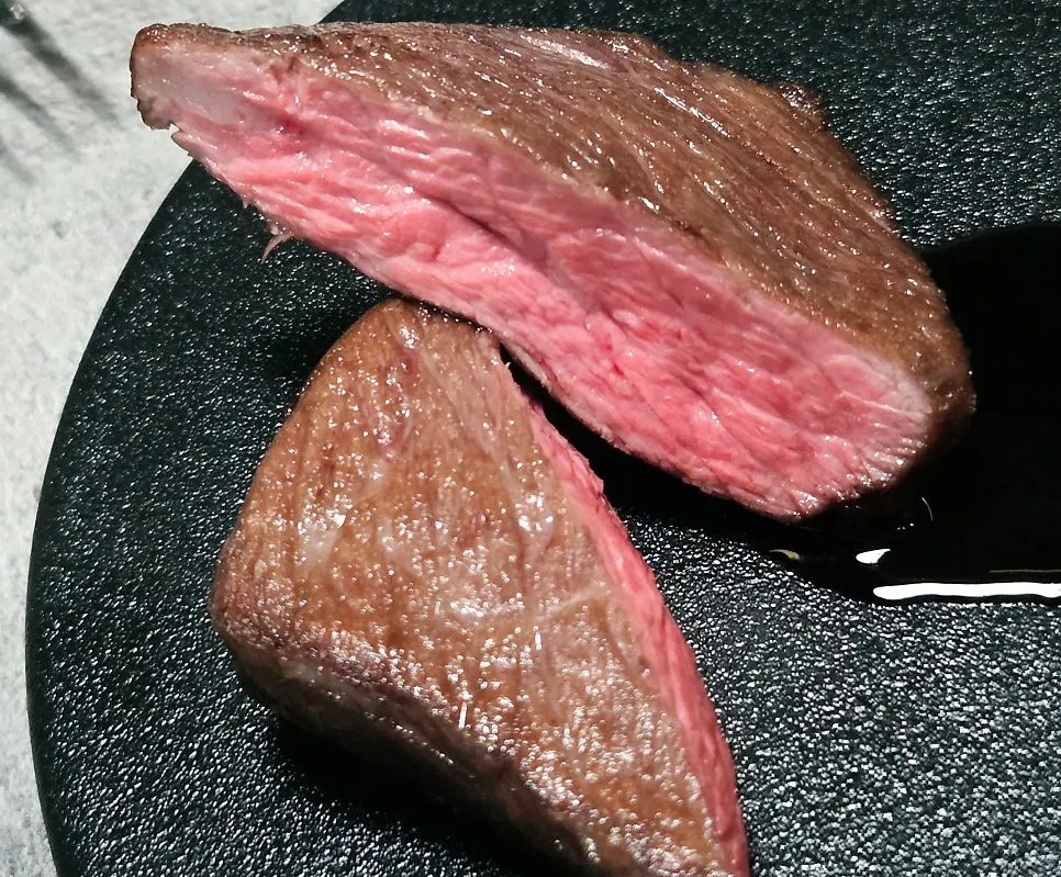 Cross-section of the sous vide steak cut with a fork
