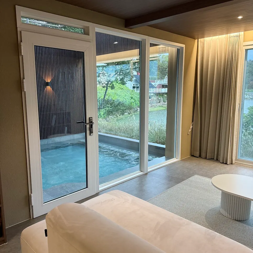 First-floor living room with a floor-to-ceiling window view