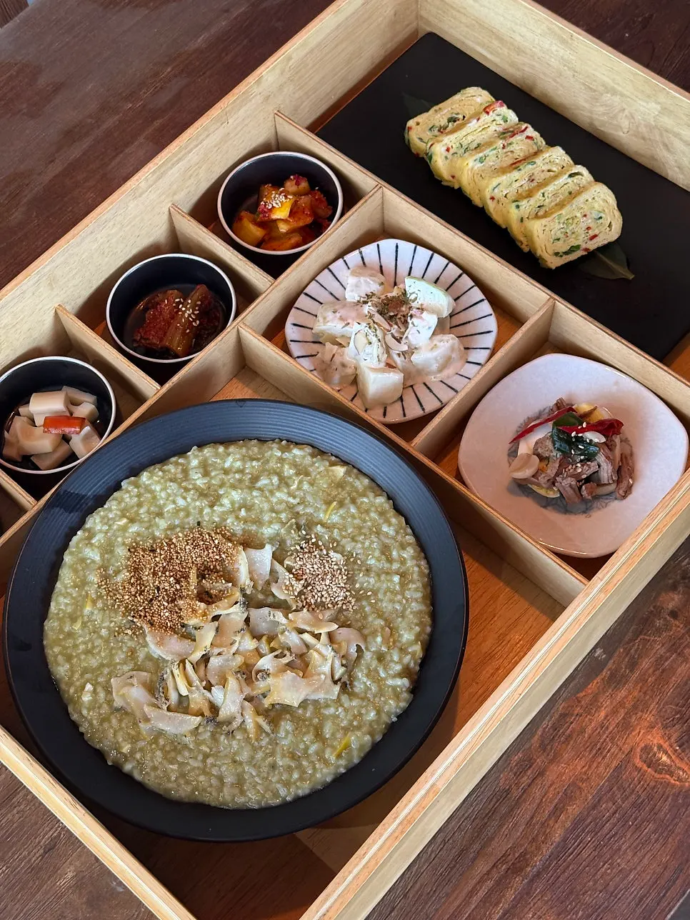 Breakfast of abalone porridge and side dishes
