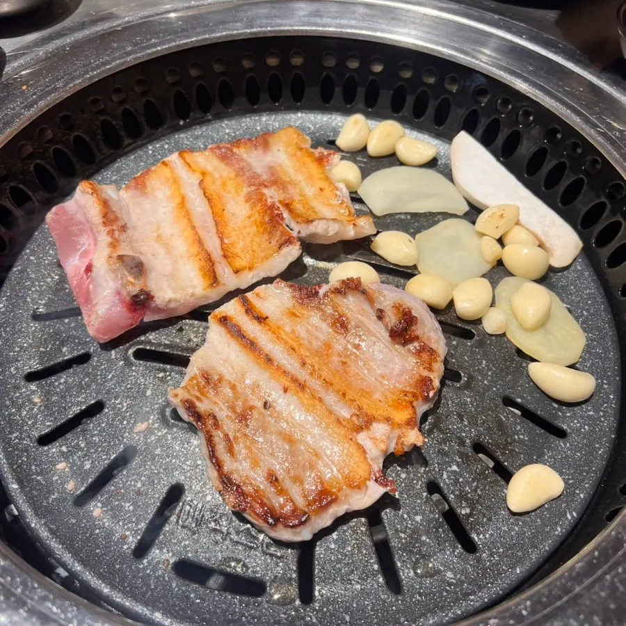 Potatoes, mushrooms, and garlic grilled alongside the meat
