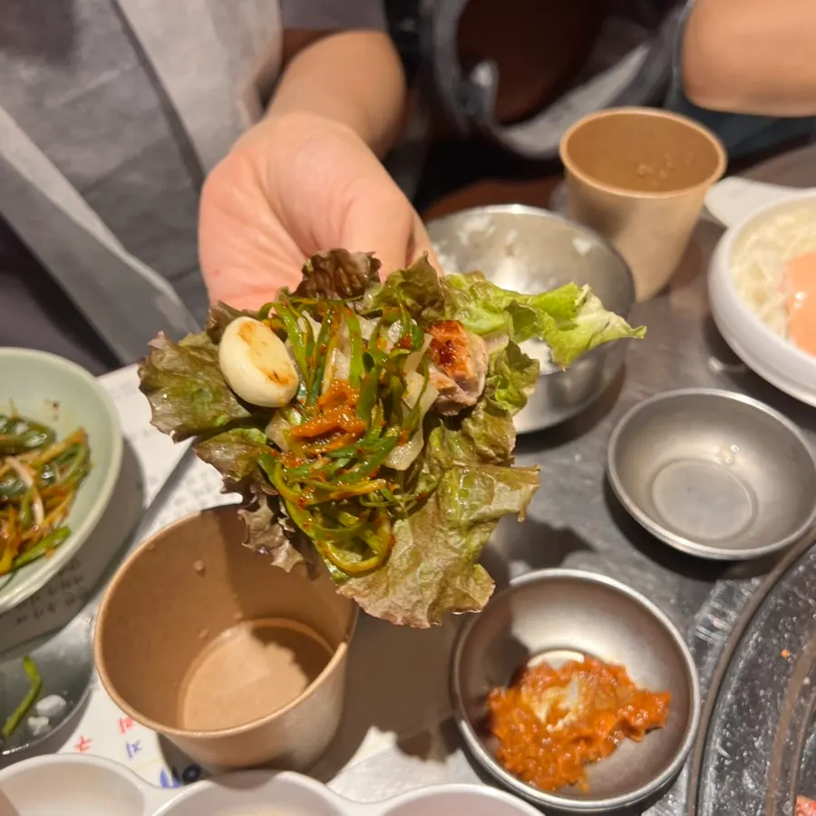 Plain rib wrapped in perilla leaf with white kimchi
