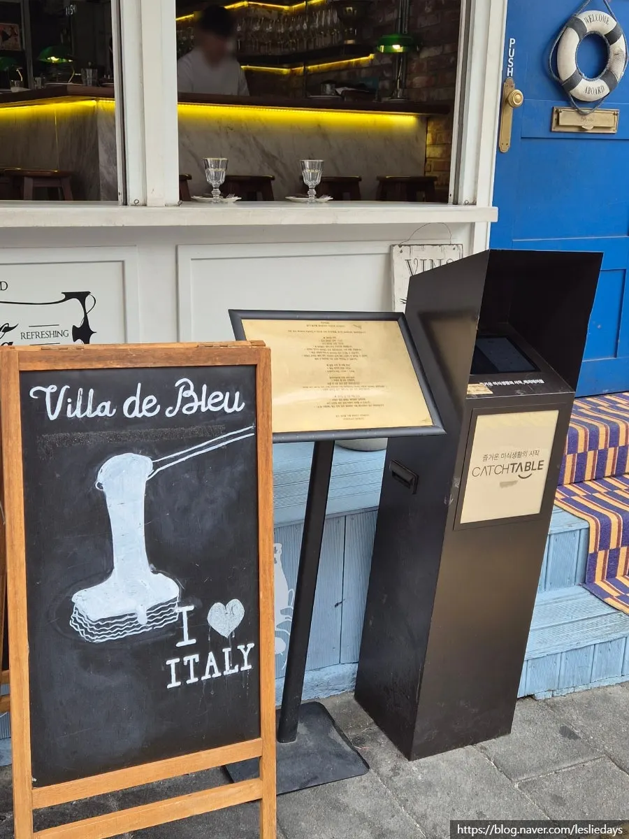 Restaurant entrance with a blue-door photo spot