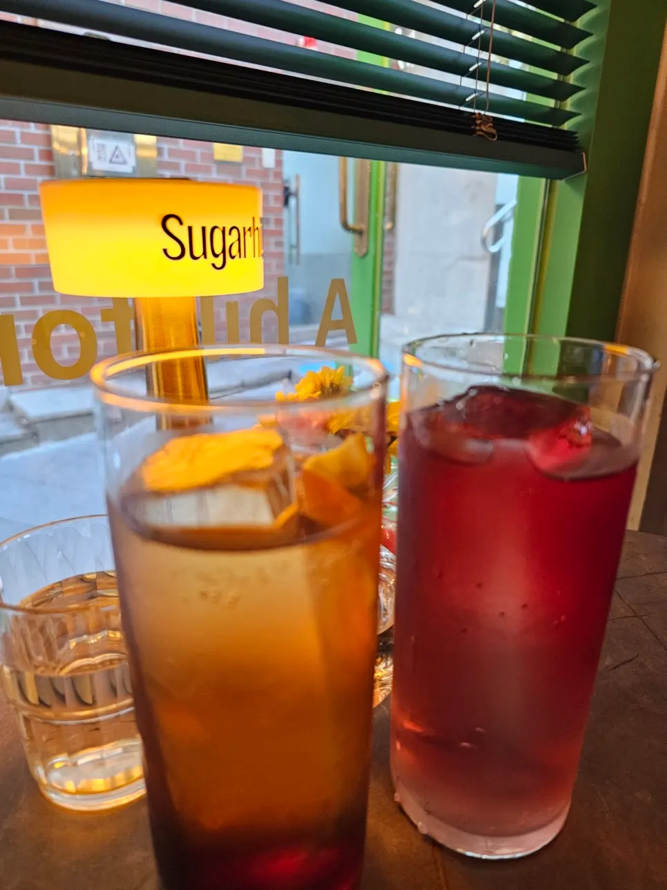 Cocktail and highball on the Sugar Hill table