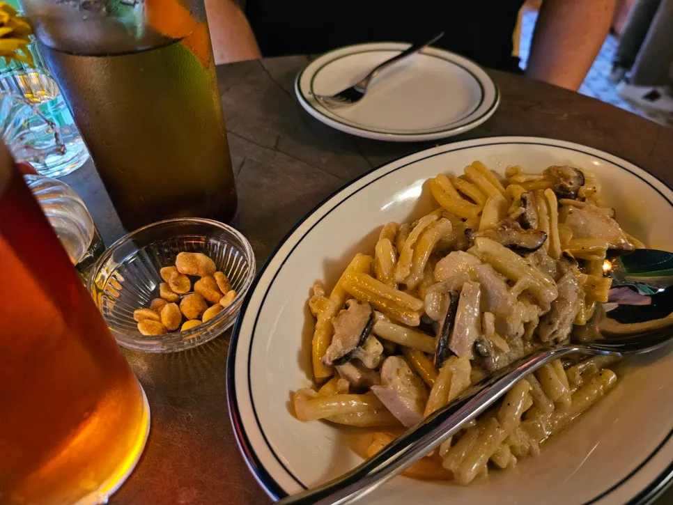 Two plates of freshly served pasta