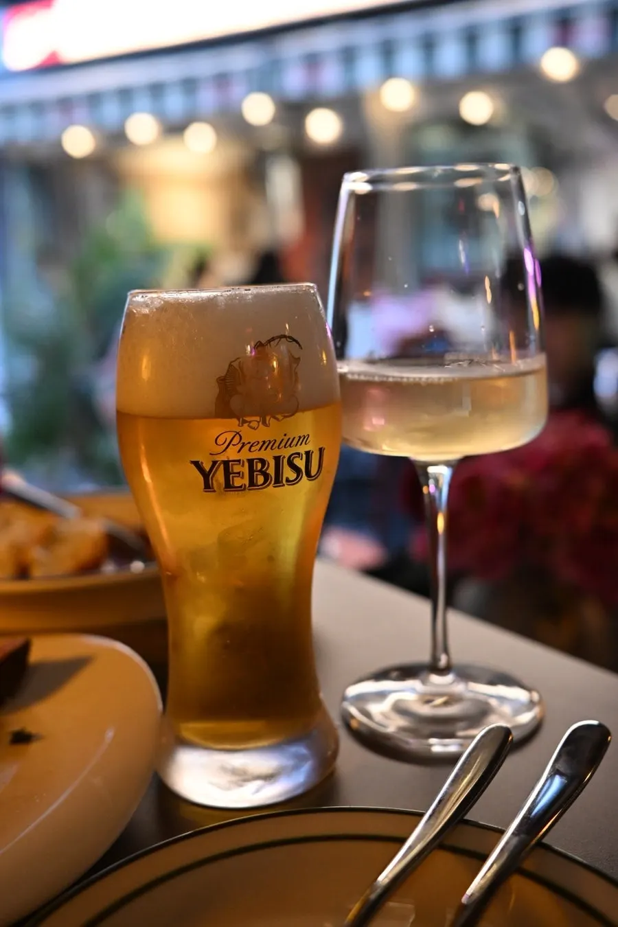 A glass of white wine paired with the cheese platter