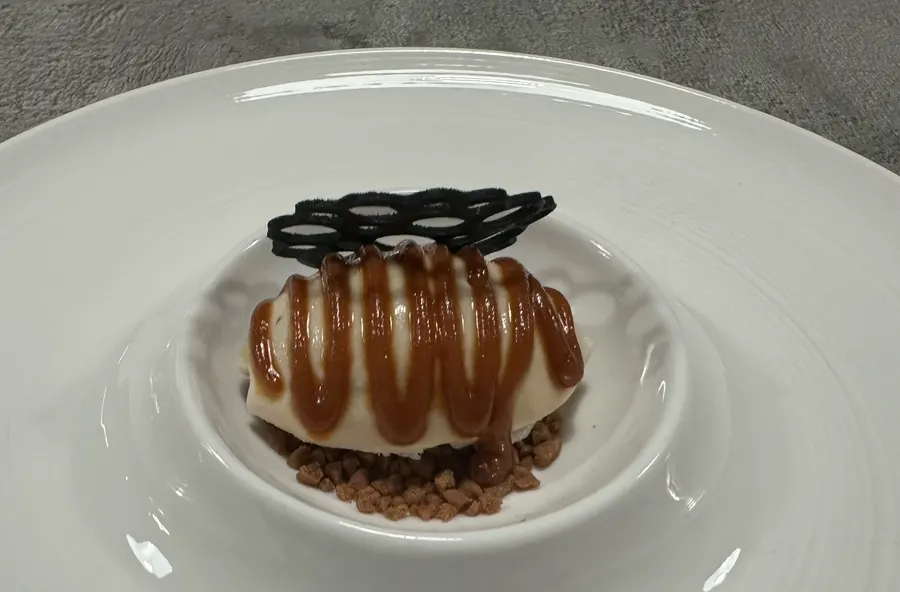 Cross-section of Earl Grey ice cream with crumble underneath