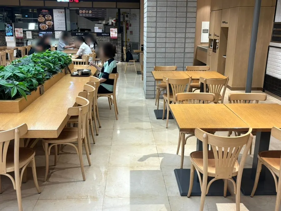 Spacious shared seating set up in front of the store