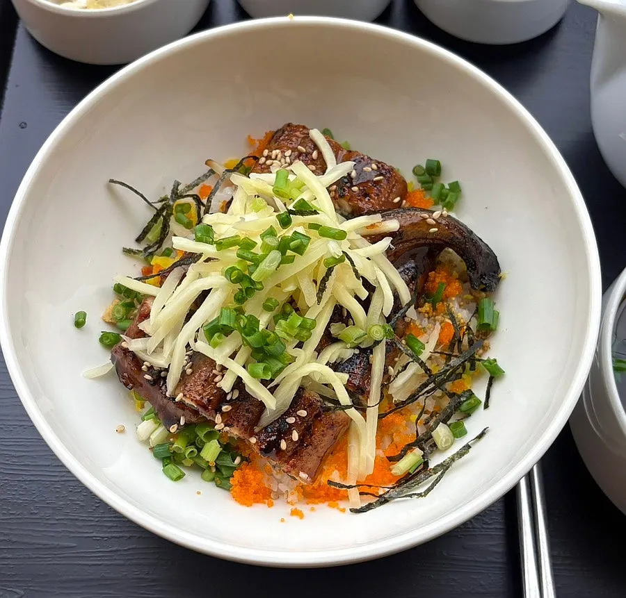 Pickled ginger served alongside the eel rice bowl