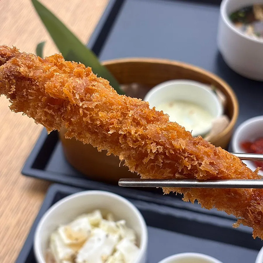 Cross-section of fried shrimp showing the crispy batter