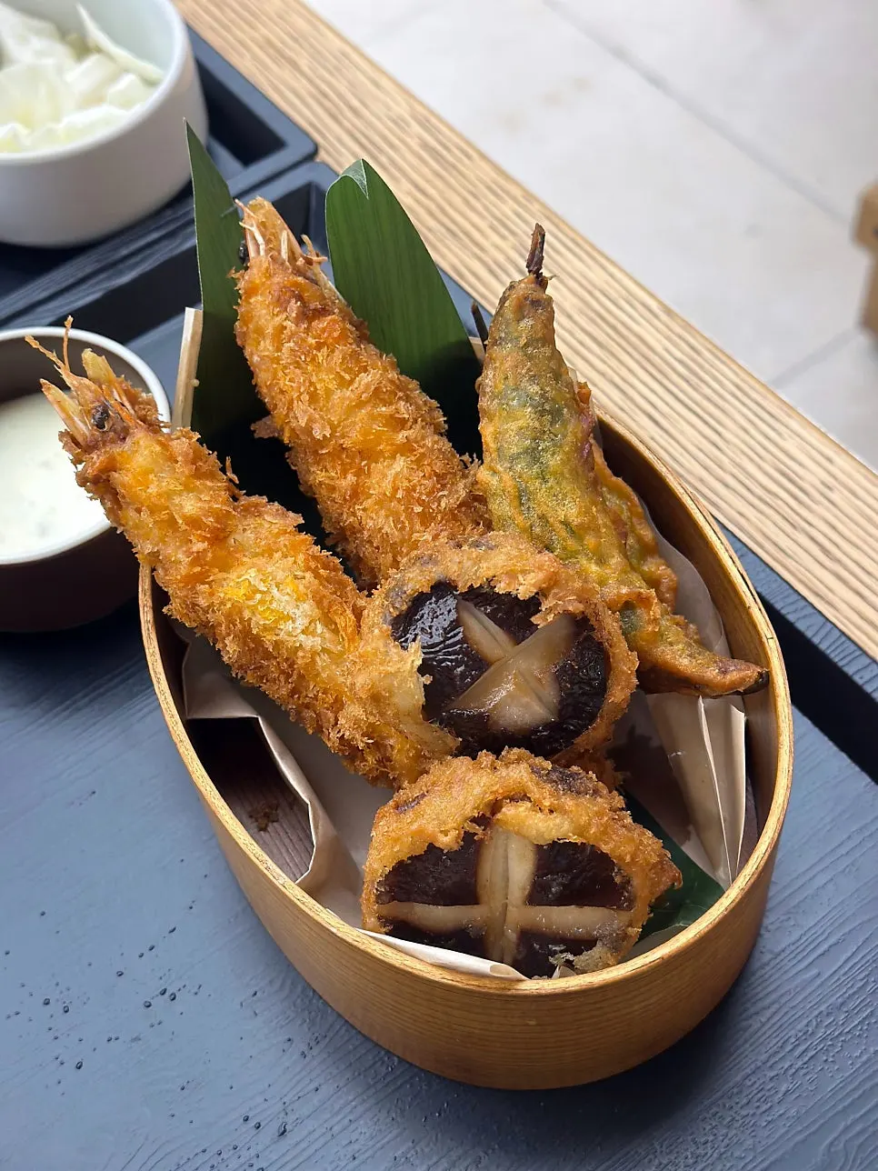 Chopsticks lifting a strand of perilla oil buckwheat noodles