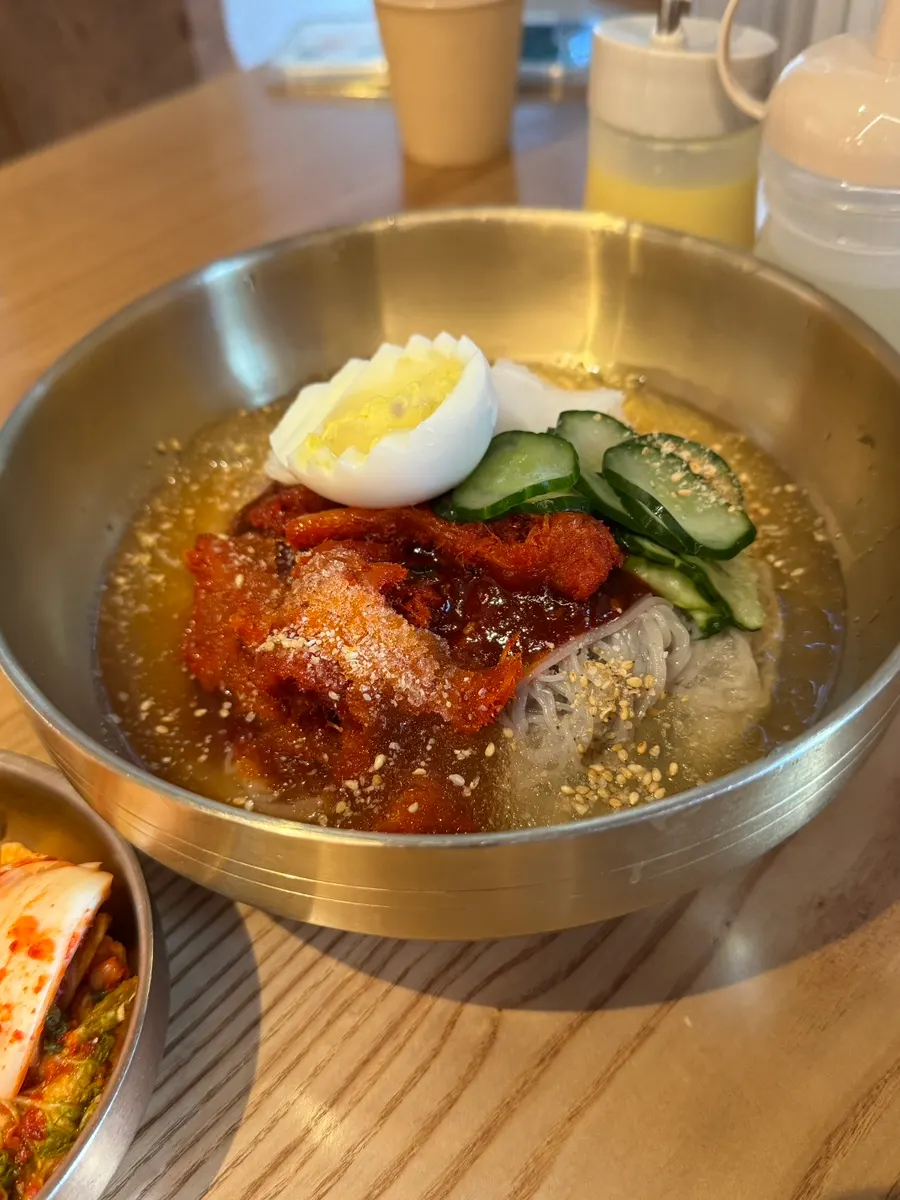 A bowl of Sokcho pollack sashimi naengmyeon