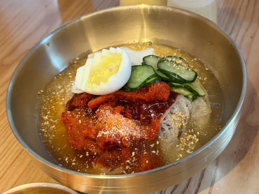Naengmyeon topped generously with pollack sashimi
