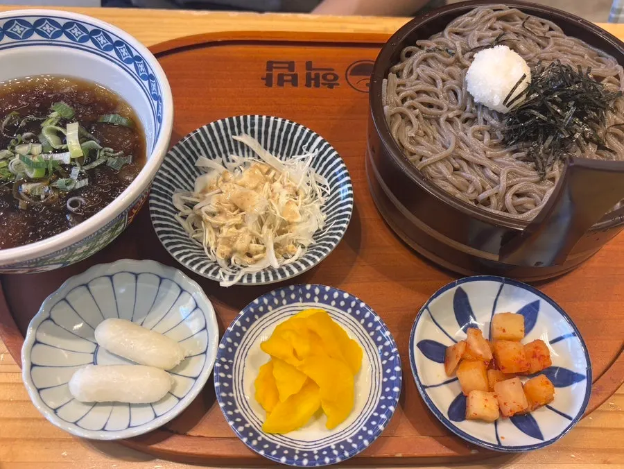 Dipping soba noodles into the zuyu sauce