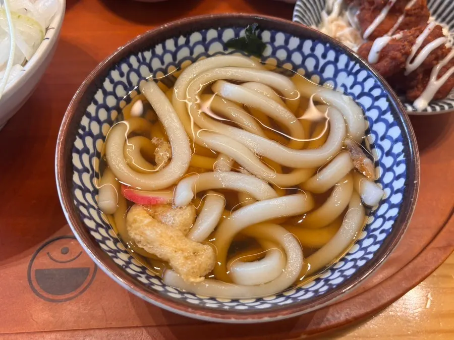 Shrimp soy sauce rice bowl topped with a soft-boiled egg yolk