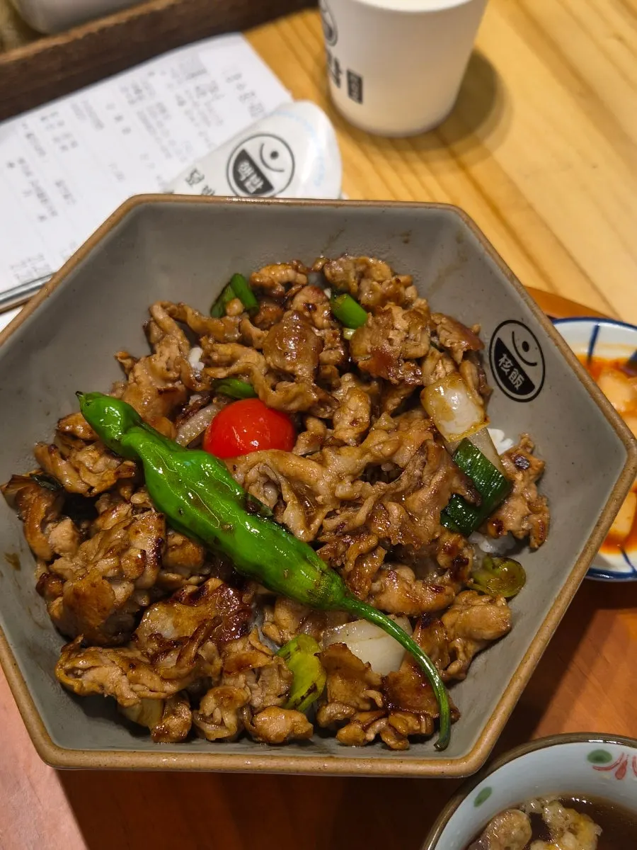Meat-loaded rice bowl piled high with meat