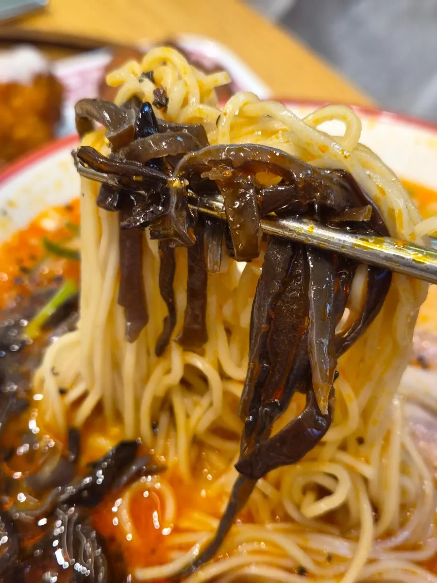 Close-up of karai ramen noodles and broth