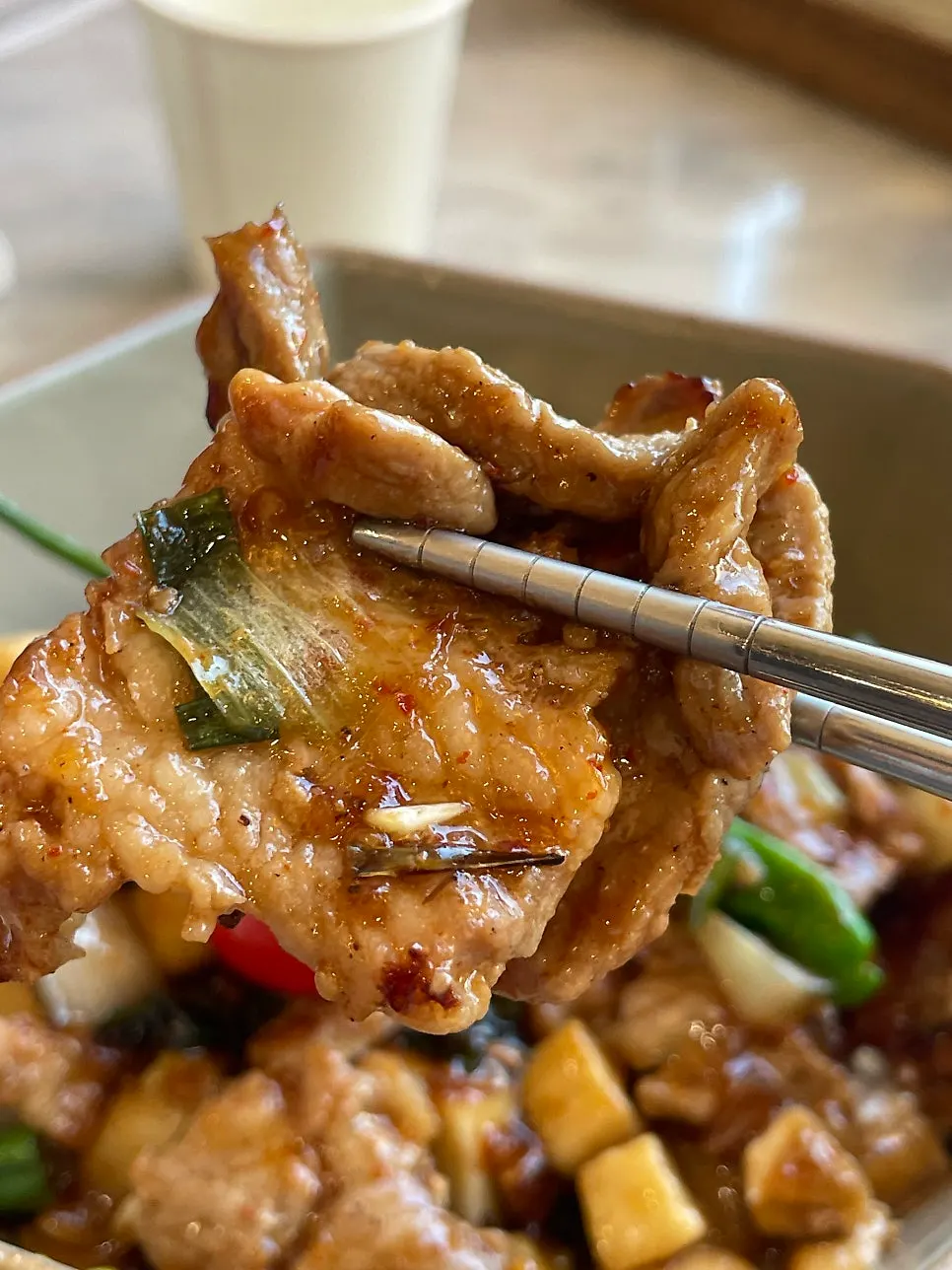 Pork ribs and vegetables piled on top of rice