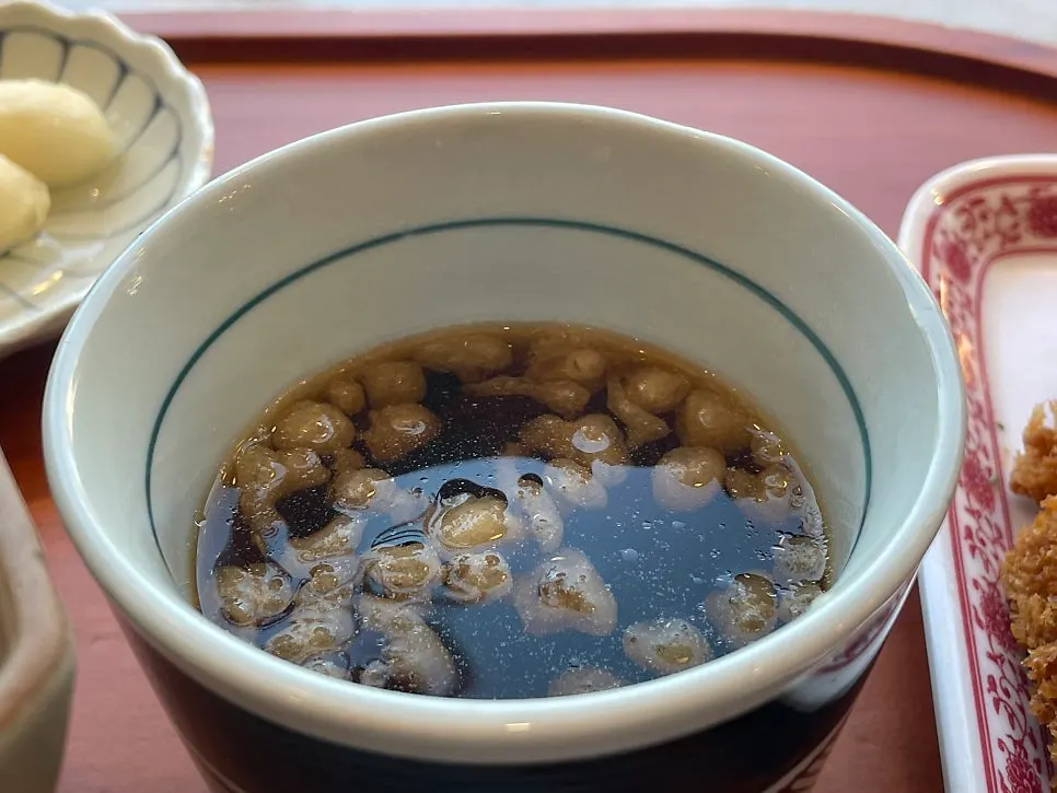 Close-up bite of the pork jowl rice bowl
