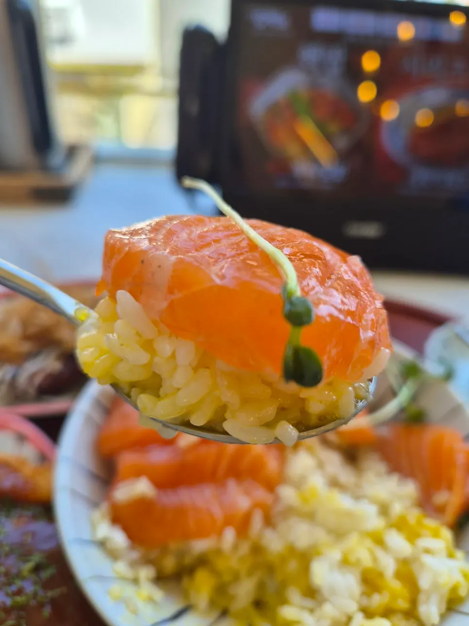 Salmon rice bowl before the yolk is broken