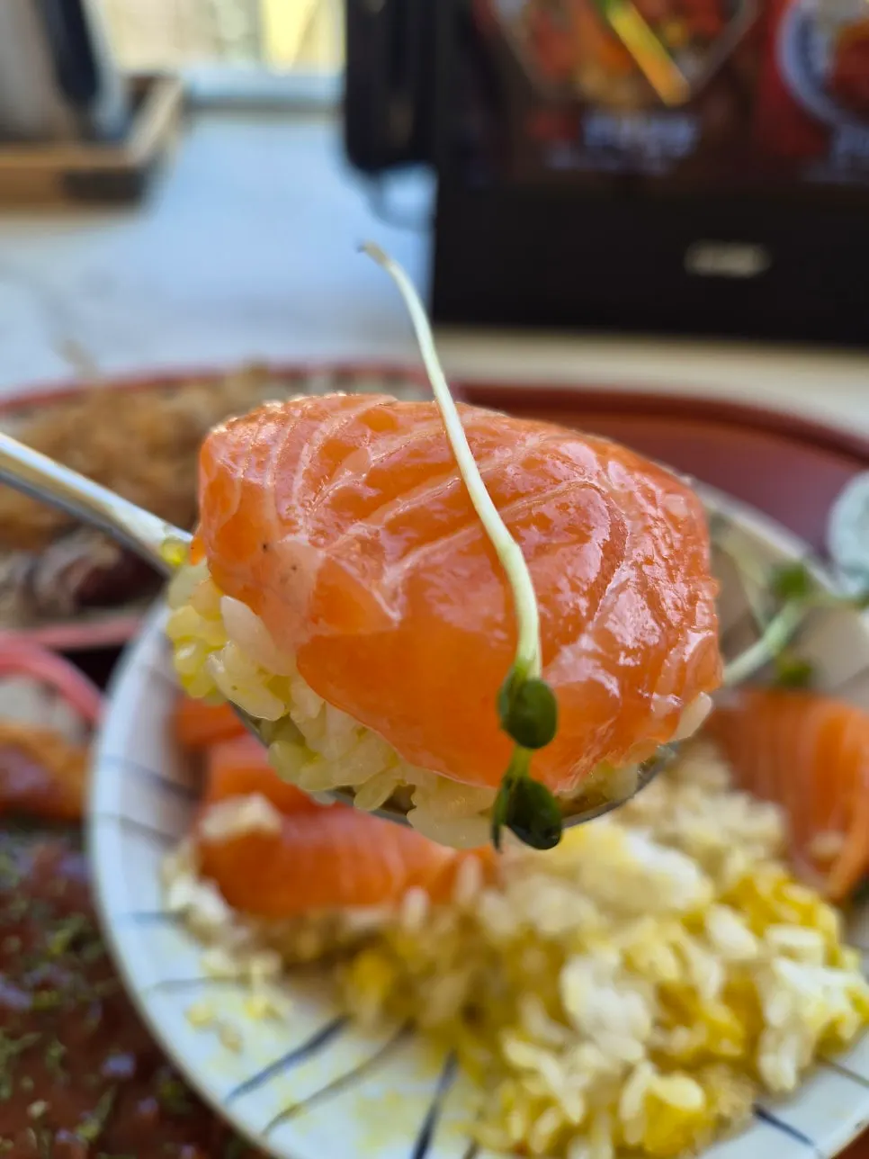 Picking up a piece of salmon